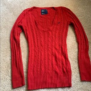 Red v-neck cable sweater